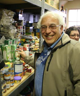 Charles-putting-food-on-shelf
